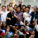 Philippine President Rodrigo Duterte poses with OFWs upon their arrival in Manila airport, Aug. 31, 2016. The workers were repatriated back to the country from Saudi Arabia.